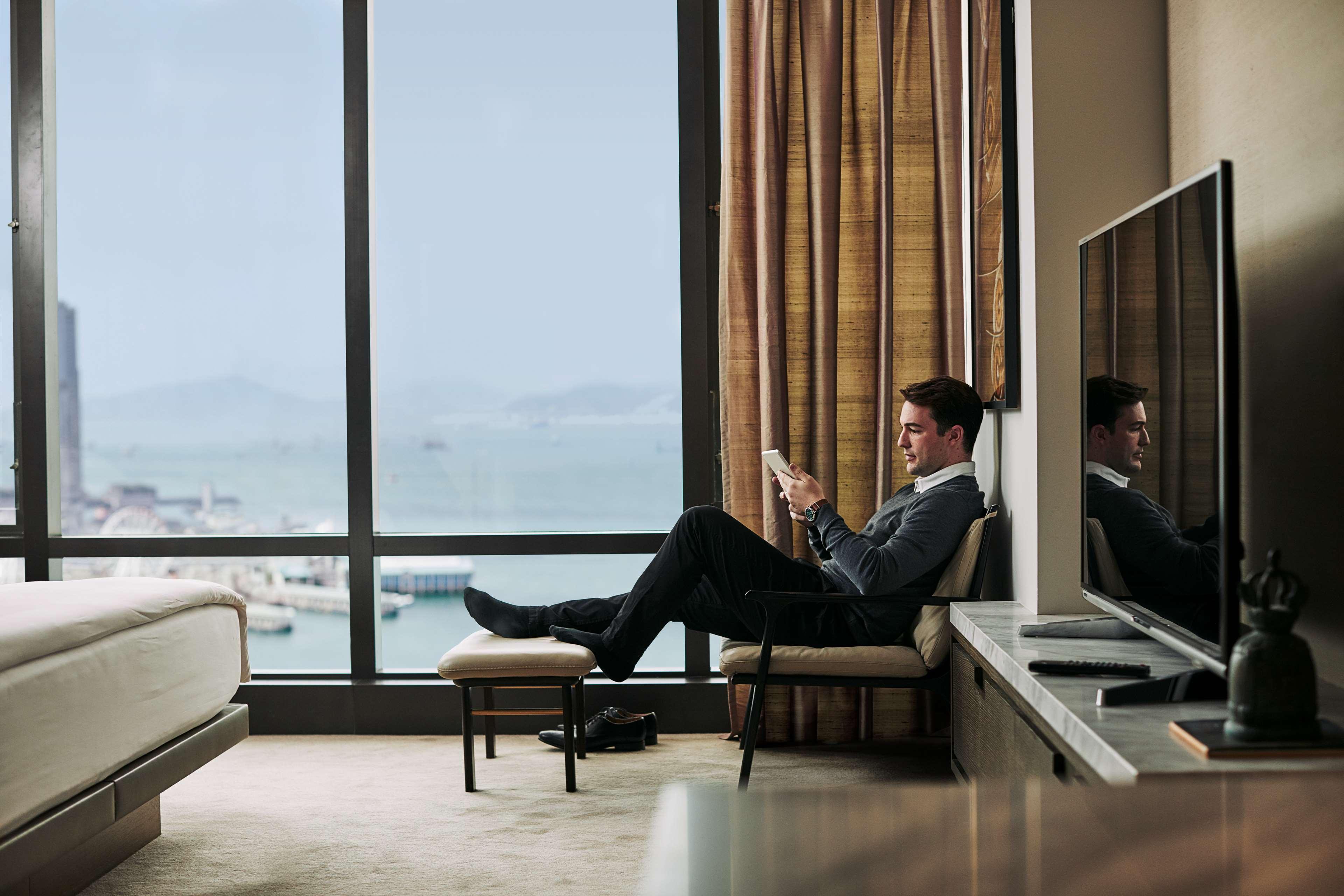 Grand Hyatt Hong Kong Hotel Exterior photo A guest in a hotel room