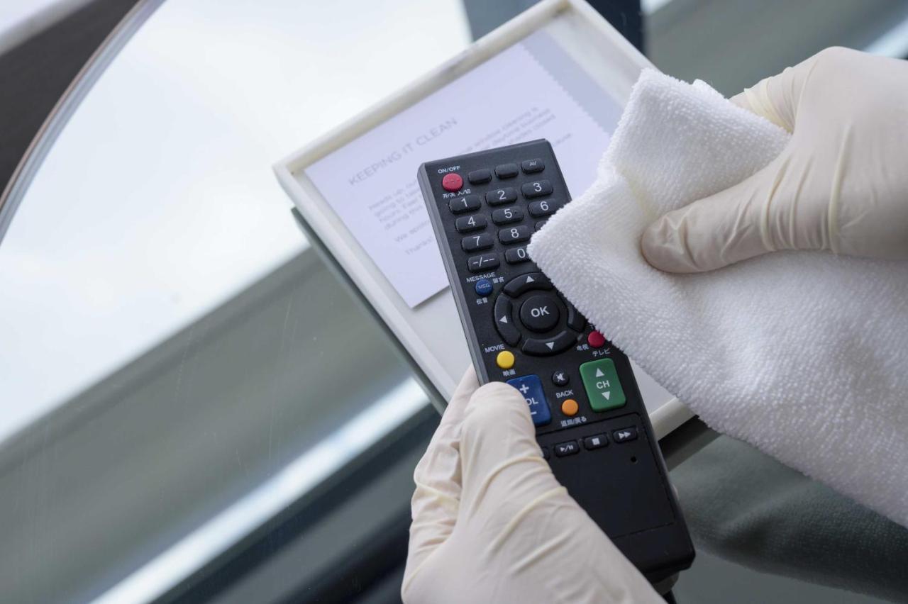 Grand Hyatt Hong Kong Hotel Exterior photo Disinfection of a remote control